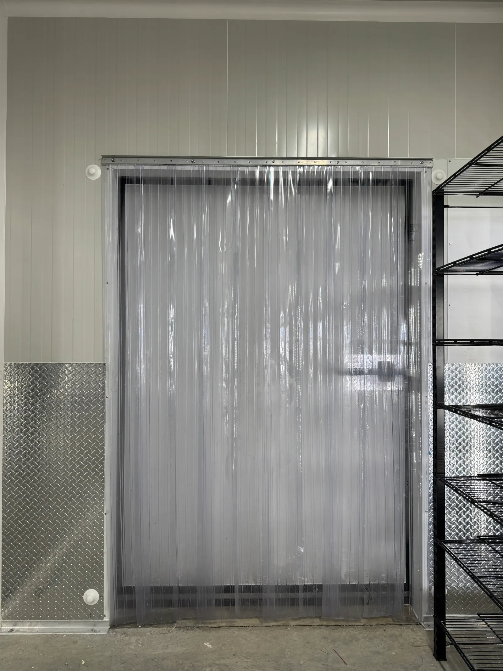 Puerta frigorífica con cortina de tiras de PVC en cámara de refrigeración